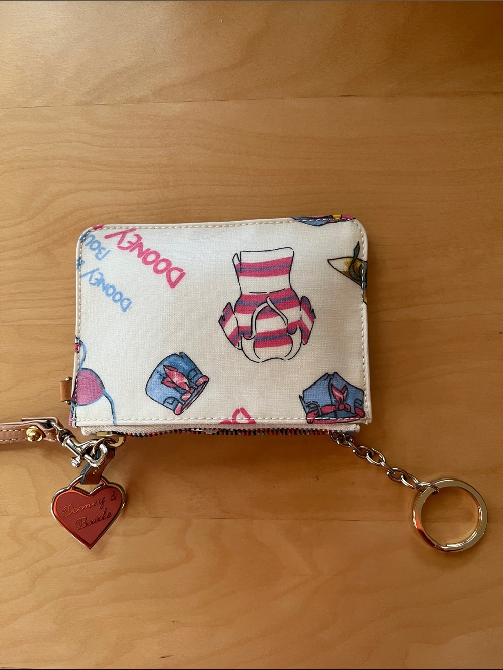 Dooney & Bourke Cream Wallet with Pink and Blue Motif and Heart Charm